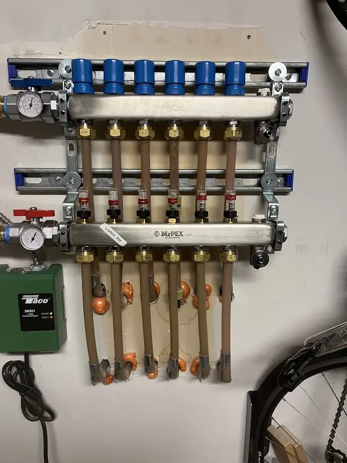 Plumber performing Water Heater Repair at a residential property in Tinton Falls